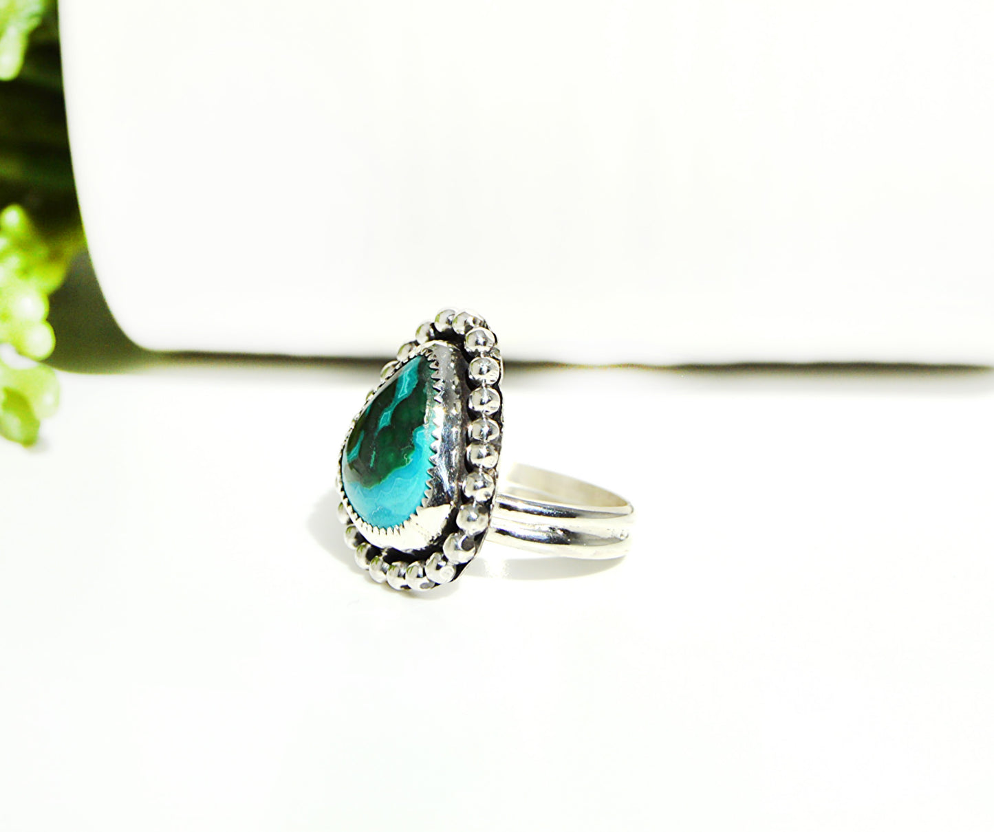 Double band ring using both sterling silver and fine silver with a beaded border and a blue and green stone. 