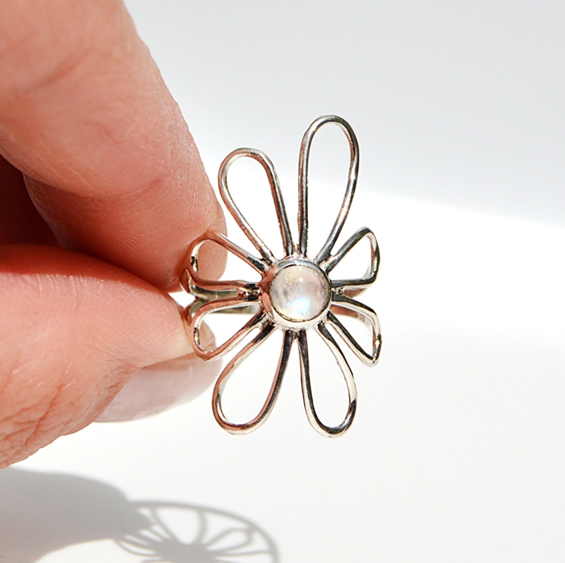 JeniMarie Jewelry with a super cool and unique ring featuring a moonstone and flower design. In sterling silver making t hypoallergenic. 