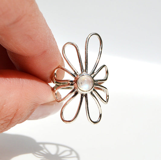 JeniMarie Jewelry with a super cool and unique ring featuring a moonstone and flower design. In sterling silver making t hypoallergenic. 