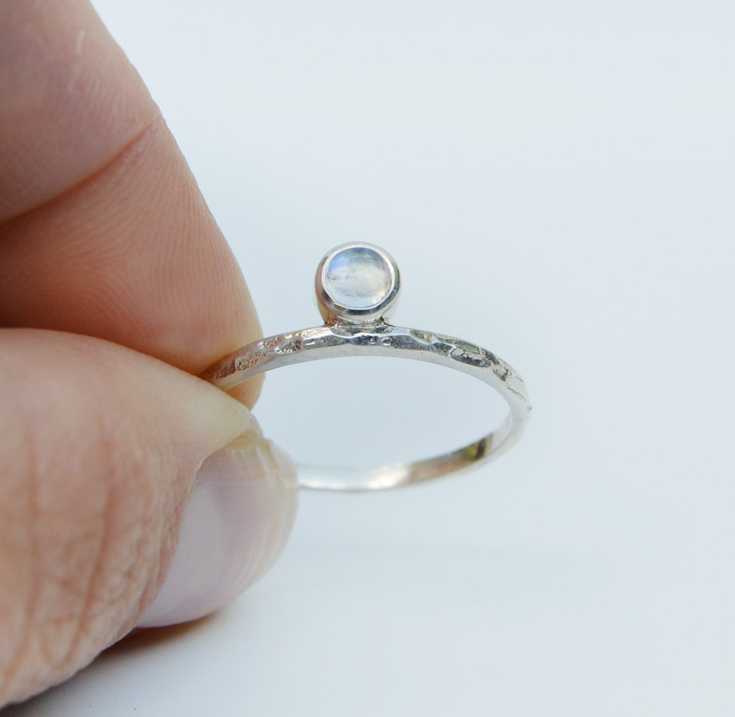 JeniMarie Jewelry with a fun and cool moonstone ring with a textured band all set in sterling silver. 