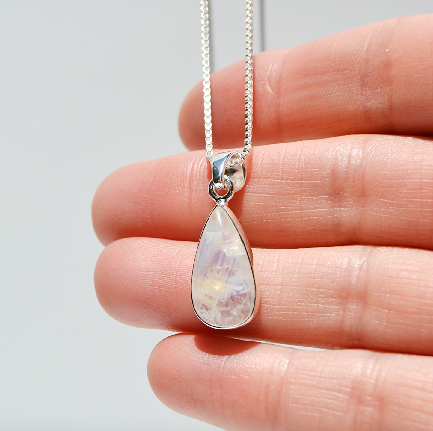 JeniMarie Jewelry with a unique and rare rainbow moonstone with 18 inch box chain to complete the look. 
