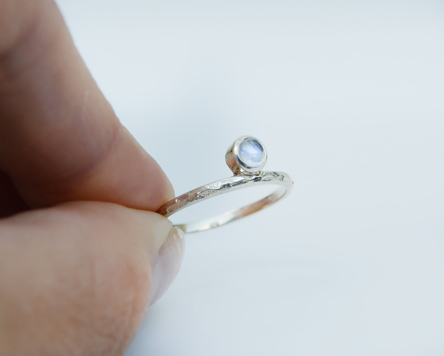JeniMarie Jewelry with a beautiful moonstone ring set in sterling silver and featuring a textured band for added appeal. 