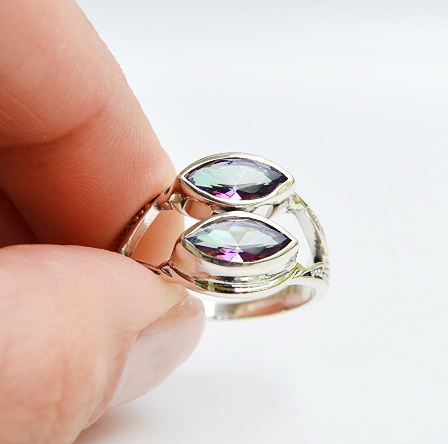 JeniMarie Jewelry with a mystic topaz double stone ring. Set in .925 sterling silver making the piece hypoallergenic. 