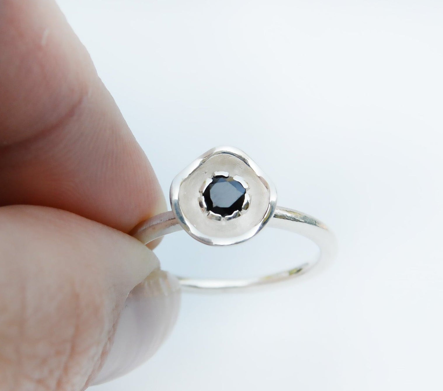 JeniMarie Jewelry with a fun and cool sterling silver flower ring featuring a stunning black onyx stone. 