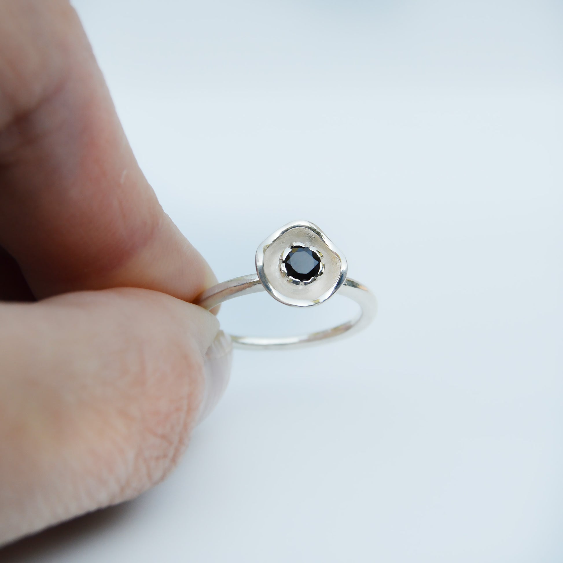 JeniMarie Jewelry with a stunning black onyx flower ring designed ring set in sterling silver and made with care. 
