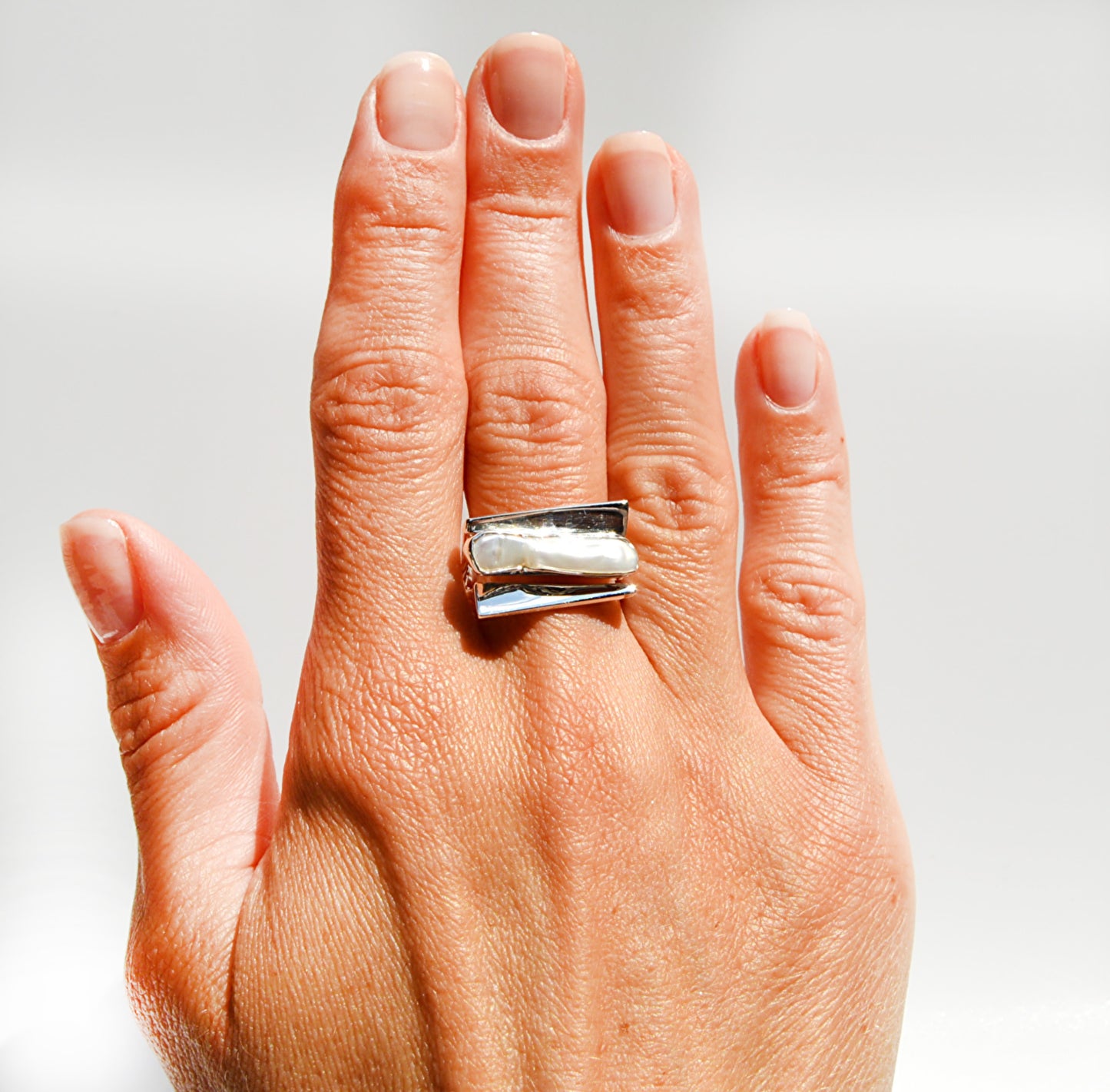 JeniMarie Jewelry with a beautiful ring using a pearl and sterling silver for a high polish. 