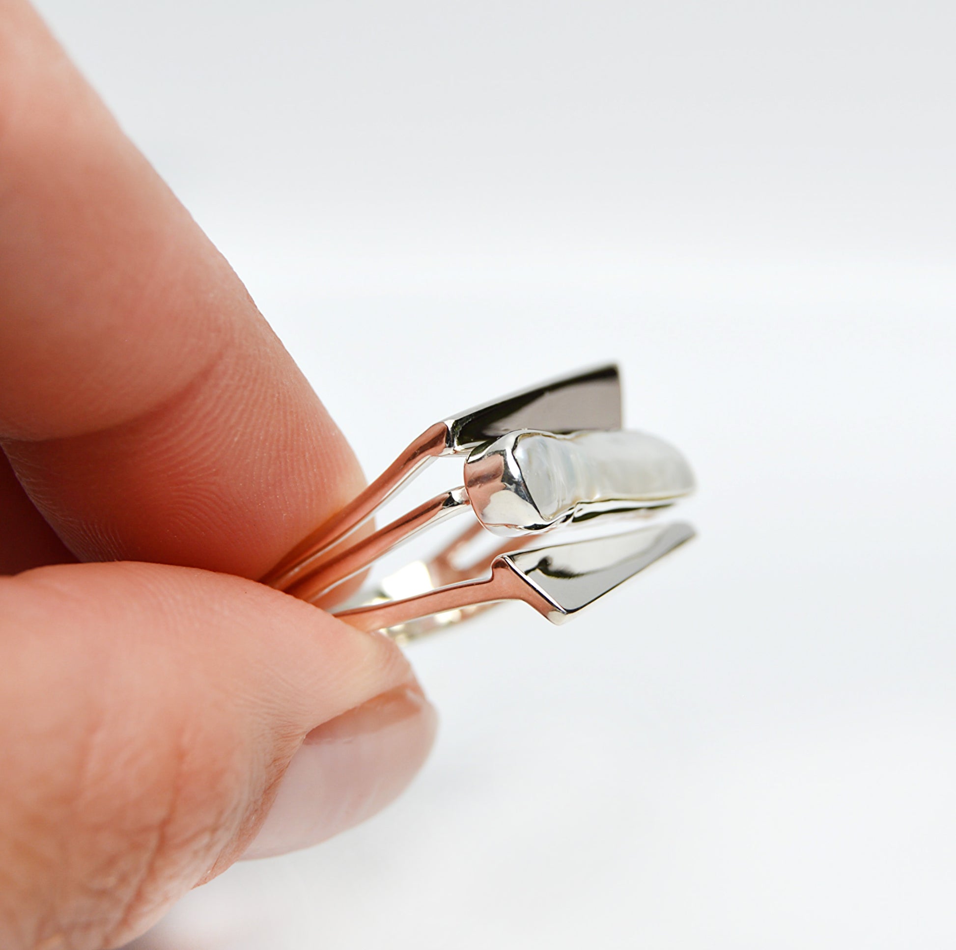 JeniMarie Jewelry with a stunning pearl ring with a multi band design set in sterling silver for a high polish and classic look. 