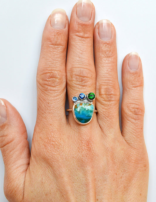 Rare Peruvian Opal ring with accent tube set stones including London Blue Topaz and Emerald. 