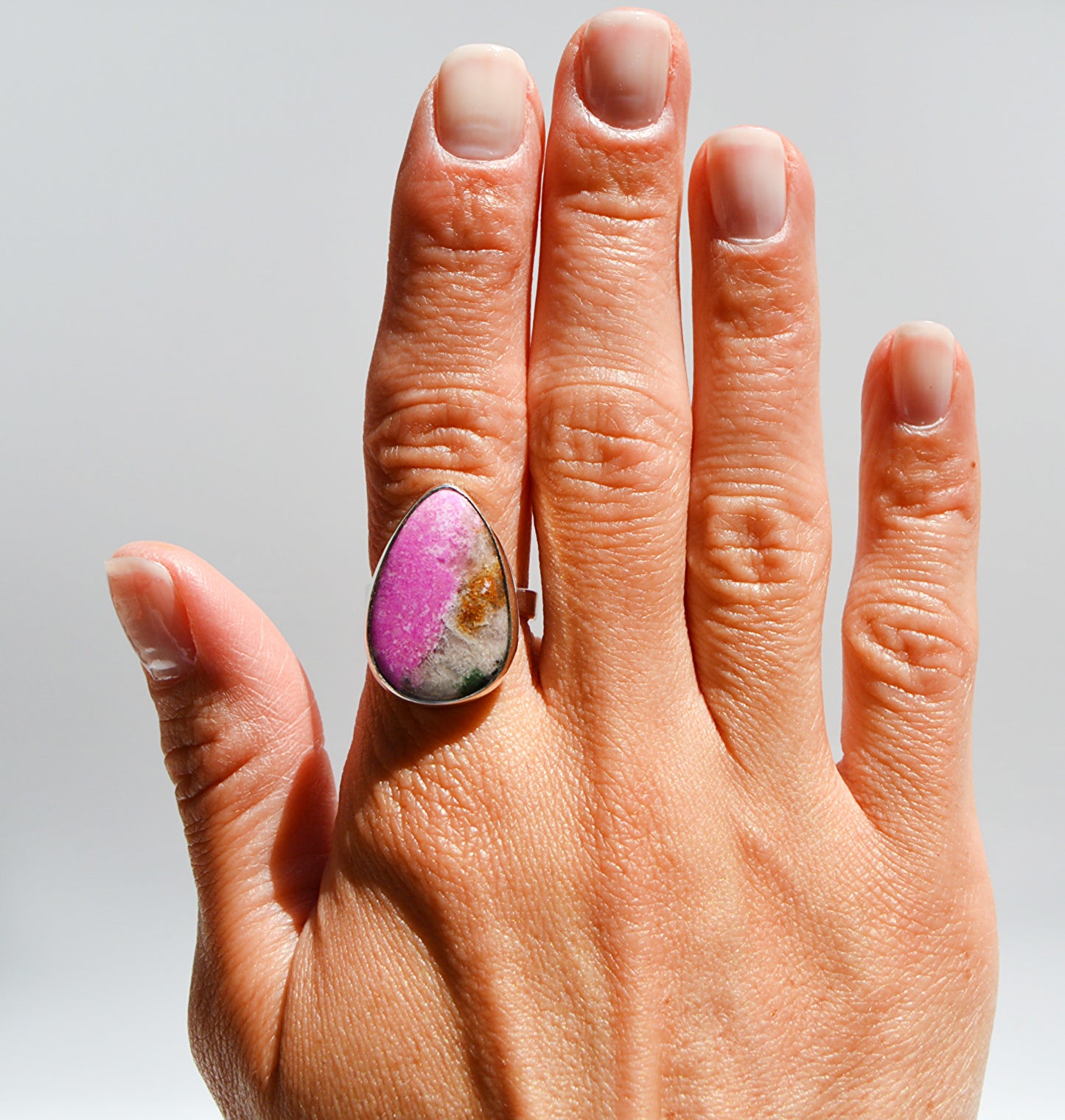 JeniMarie Jewelry with a custom and rare pink druzy set in sterling silver with an adjustable band. 