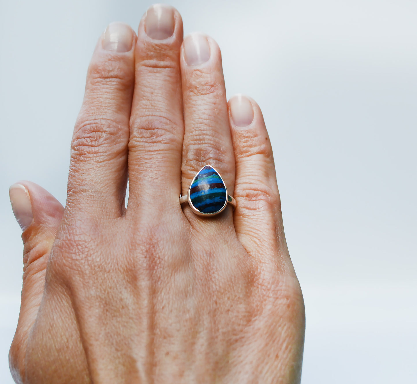 JeniMarie Jewelry with a custom rainbow calcite ring set in sterling silver. 