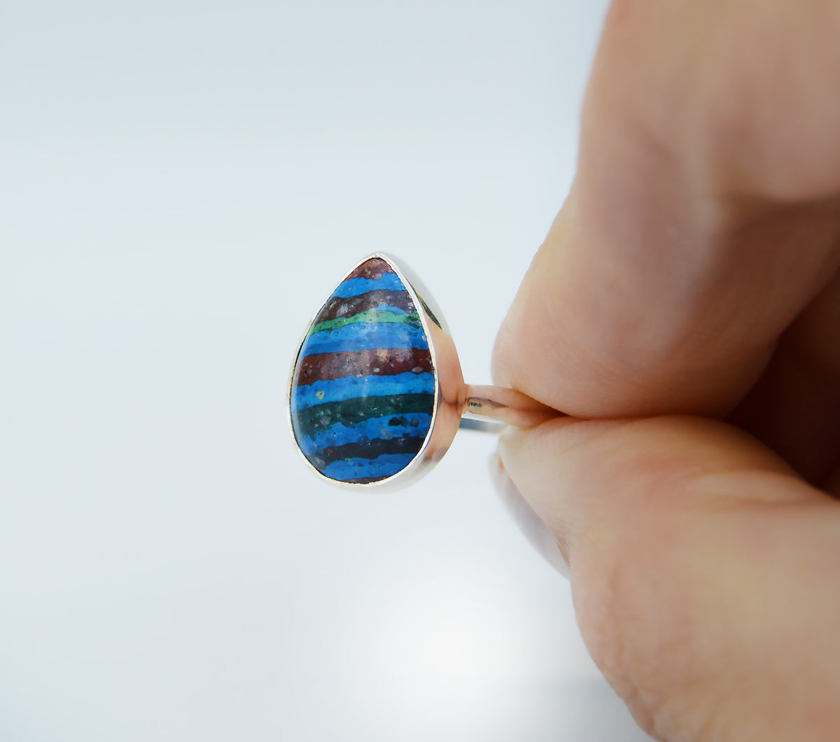 JeniMarie Jewelry with stunning rainbow calcite ring set in sterling silver and hand polished for a high shine. 