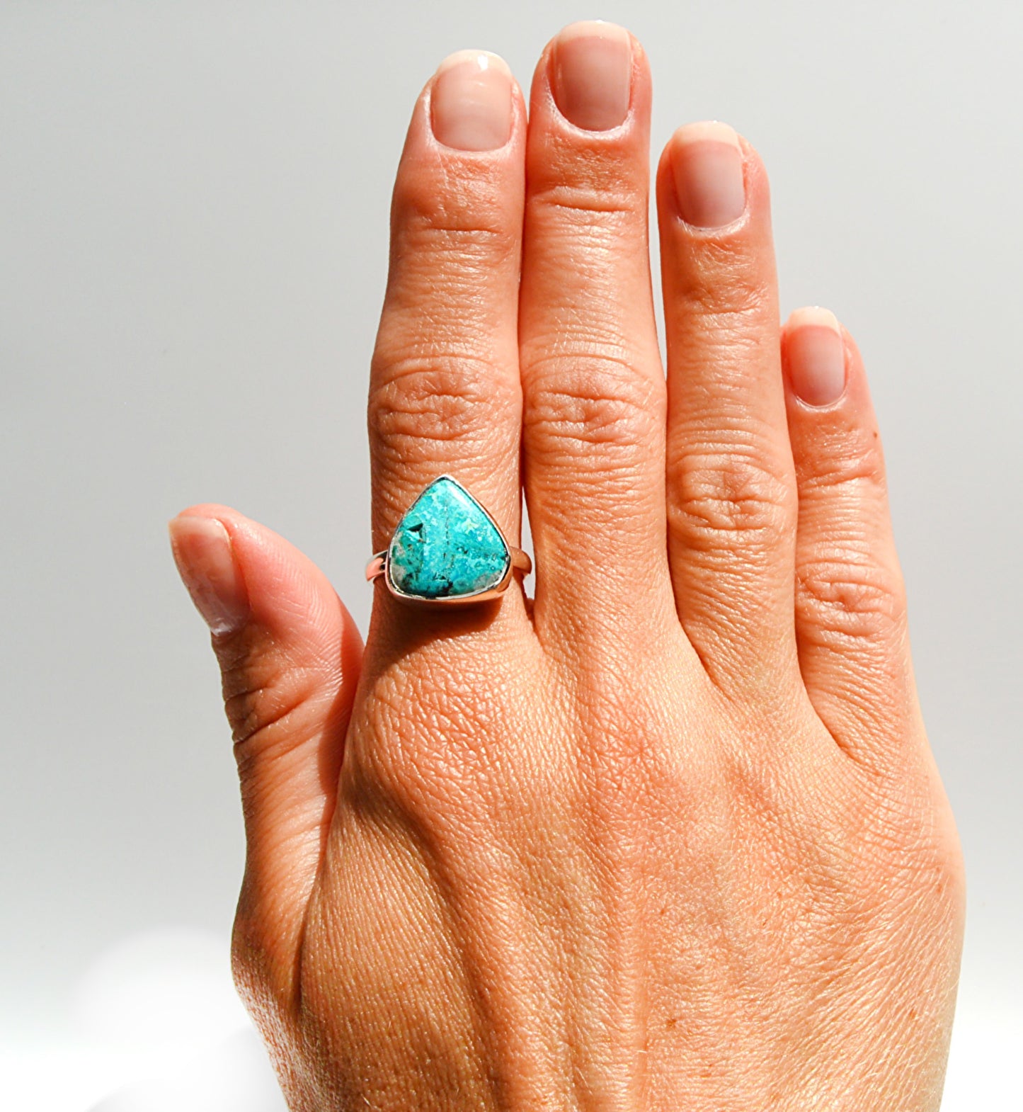 JeniMarie Jewelry with a statement ring with an ocean blue stone set in sterling silver. 