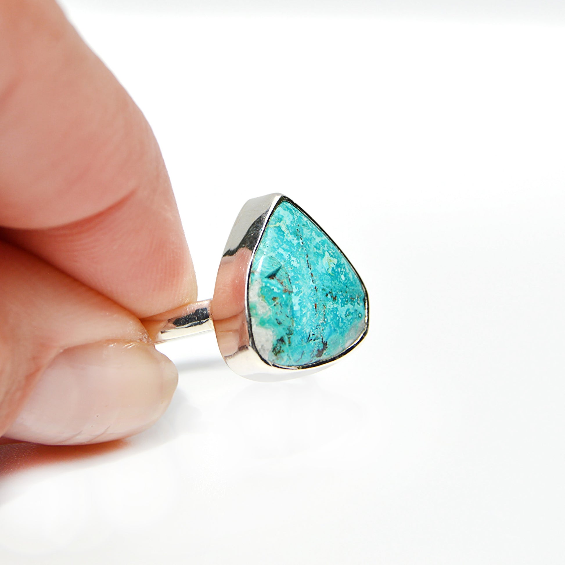 JeniMarie Jewelry with a rare ocean blue shattuckite stone set in sterling silver making it a one of a kind ring. 