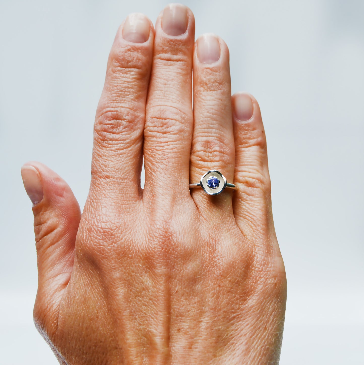 JeniMarie Jewelry with a fun and unique purple tanzanite flower ring made with sterling silver. 