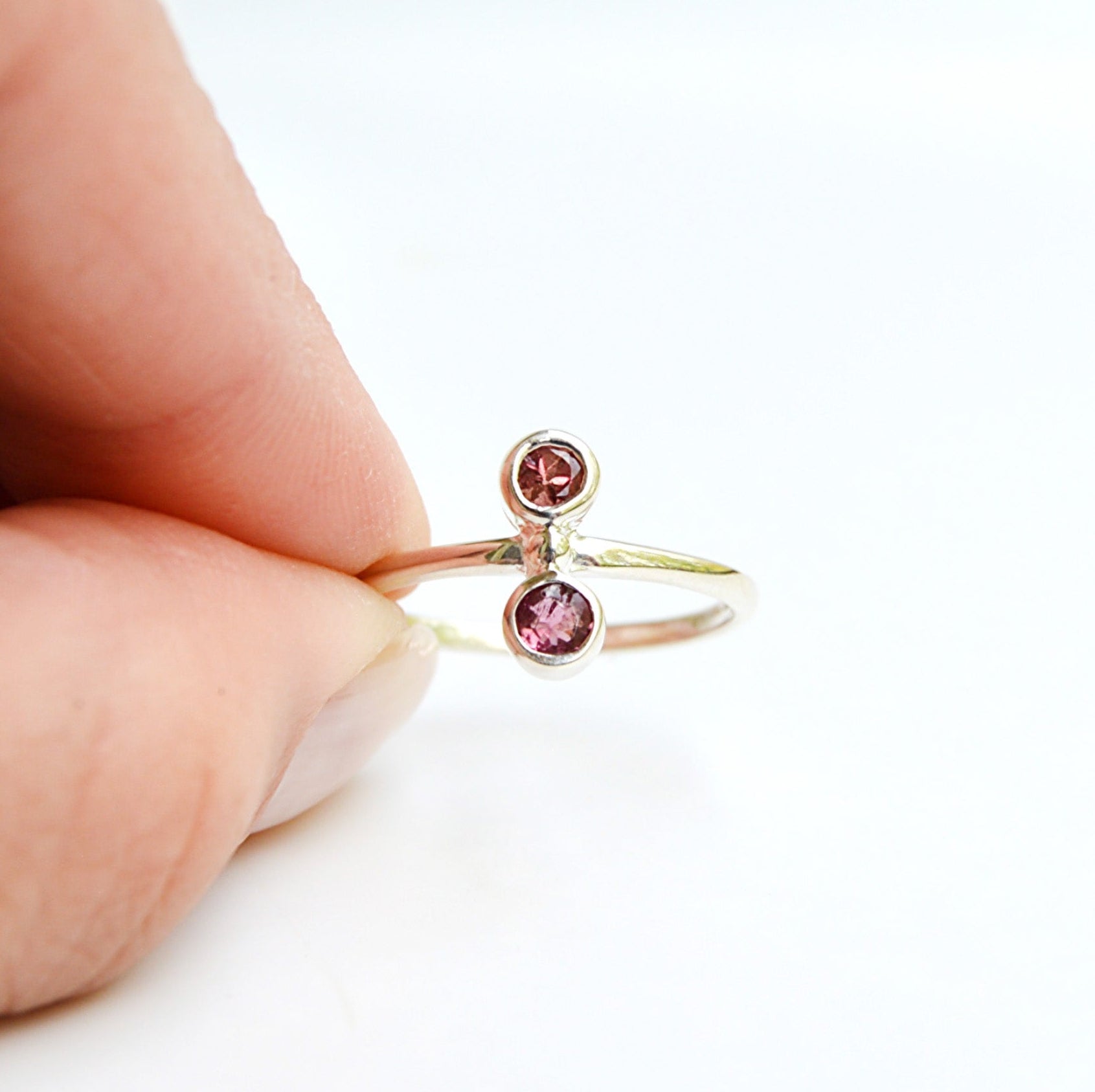 JeniMarie Jewelry watermelon tourmaline ring set in sterling silver. Features two stones with a comfort band ring. 