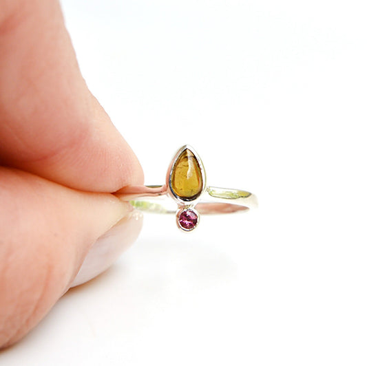 JeniMarie Jewelry watermelon tourmaline ring showcasing a comfort band and two stones. 