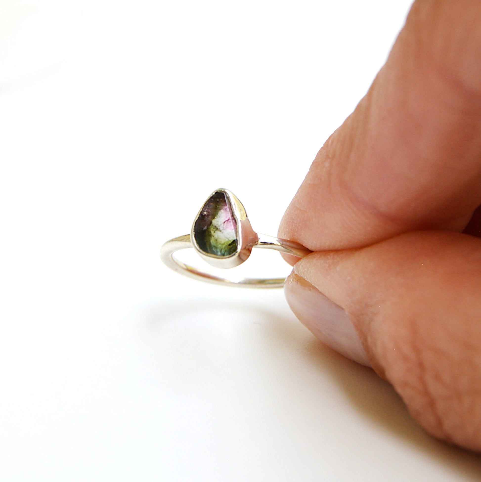 JeniMarie Jewelry presents a tube set watermelon tourmaline ring set in sterling silver polished for a high shine. Hypoallergenic. 
