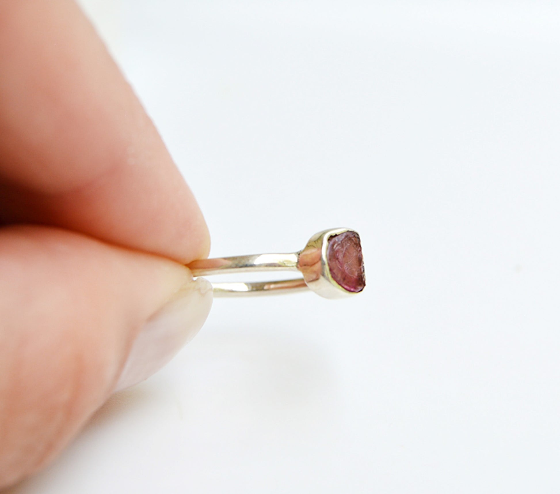 JeniMarie Jewelry showing a watermelon tourmaline in a rare cut stone tube set in sterling silver .925 making the piece hypoallergenic. 