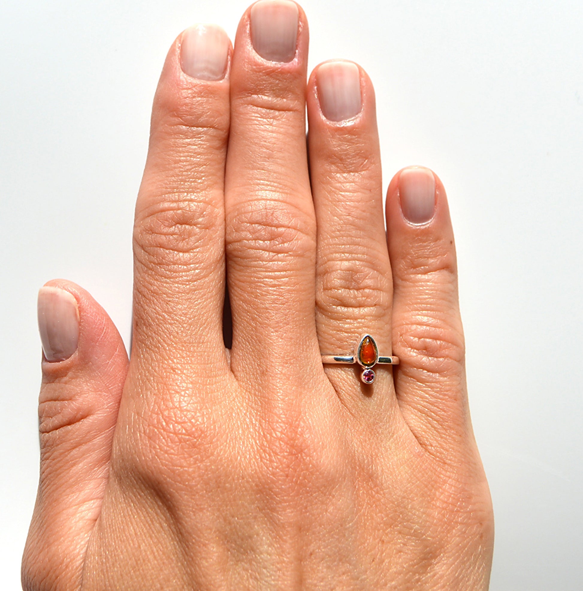 Tube set dual stone watermelon tourmaline ring from JeniMarie Jewelry. The ring is set in polished sterling silver and is hypoallergenic. 