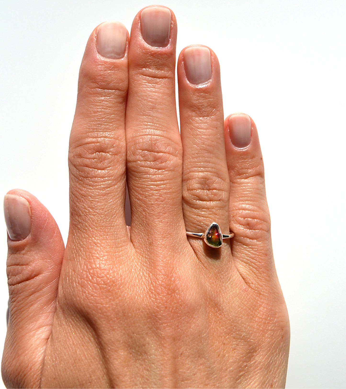JeniMarie Jewelry shows a rare cut unique watermelon tourmaline ring with a comfort band. The ring is .925 sterling silver making it hypoallergenic. 